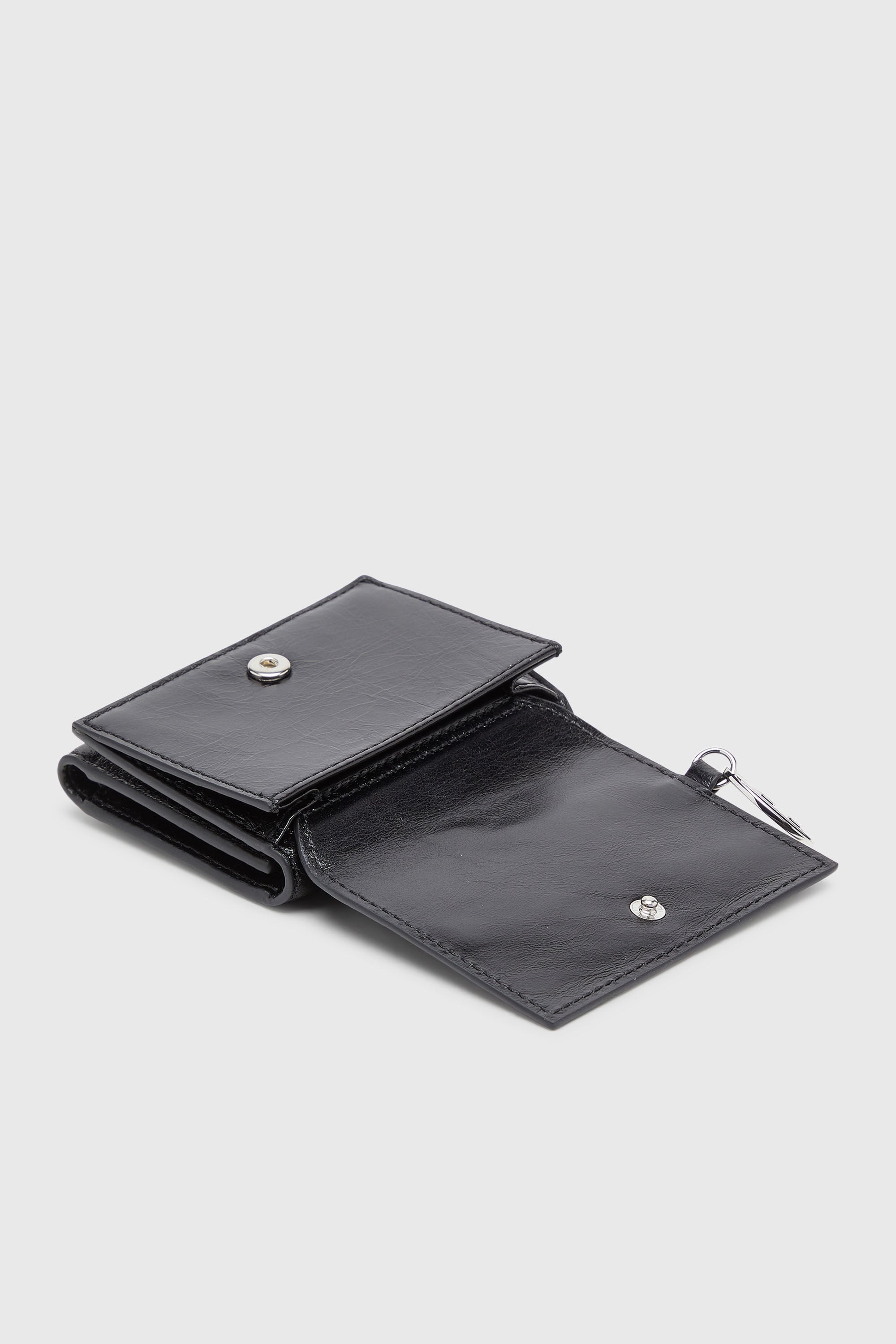 Diesel - OVAL-D TRI FOLD ZIP COIN XS II, Woman's Leather tri-fold wallet with embossed motif in Black - 4